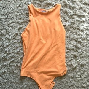 Bright orange bodysuit